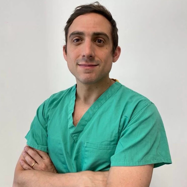 Andrew-Pieri-Breast-Surgeon Andrew Pieri in medical scrubs