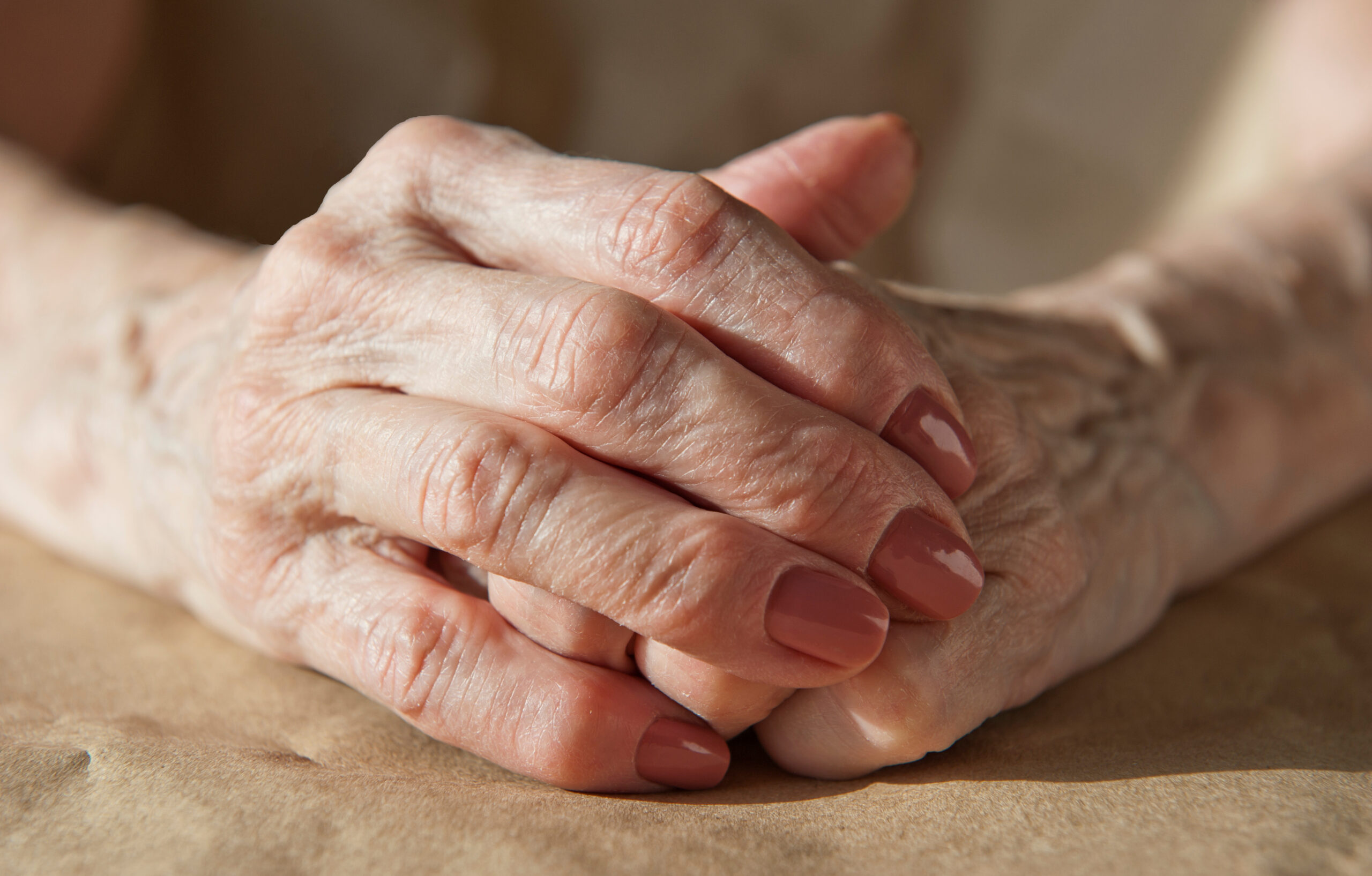 Ageing woman suffering from breast ptosis
