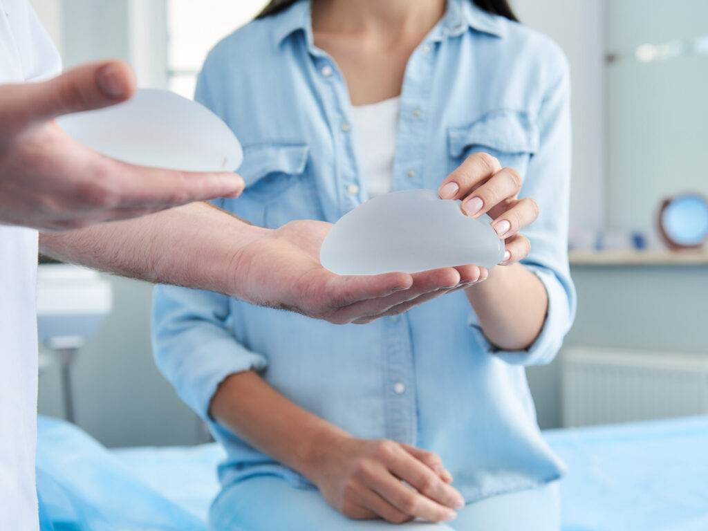 woman checking breast implants
